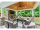 Covered outdoor living area with fireplace and comfortable seating at 5130 Watersail Way, Clover, SC 29710
