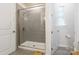 Modern shower features glass doors, tile surround, and modern fixtures in a well lit bathroom at 5130 Watersail Way, Clover, SC 29710