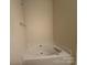 Secondary bathroom displays a soaking tub with a silver faucet and hardware at 5476 Ives Nw St, Concord, NC 28027