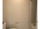 A view of the bathroom with a toilet, towel rack and gold door handle at 5476 Ives Nw St, Concord, NC 28027