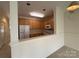 Bright kitchen features wooden cabinets, white appliances, and functional layout at 5476 Ives Nw St, Concord, NC 28027