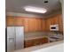 Bright kitchen features wooden cabinets, modern appliances, and a functional layout at 5476 Ives Nw St, Concord, NC 28027
