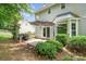 Outdoor space with a patio, grill, and view of the well-maintained yard at 6033 Edinmeadow Ln, Charlotte, NC 28269