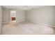 Spacious bedroom featuring neutral walls, carpet flooring, and an en suite bathroom at 6033 Edinmeadow Ln, Charlotte, NC 28269