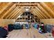 Unfinished attic with plywood walls, open rafters and some storage at 620 River Birch Dr, Salisbury, NC 28146