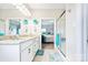 Bright bathroom with double vanity, granite countertops, shower, and view into the Primary bedroom at 620 River Birch Dr, Salisbury, NC 28146