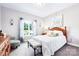 Cozy bedroom featuring a wooden bed, dresser, natural light, and light-colored walls at 620 River Birch Dr, Salisbury, NC 28146