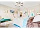 Bright bedroom with ceiling fan, TV, and queen bed featuring bright white and teal bedding accents at 620 River Birch Dr, Salisbury, NC 28146
