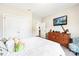 Comfortable bedroom featuring a wood dresser, mounted TV, and closet space at 620 River Birch Dr, Salisbury, NC 28146