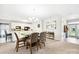 Dining area featuring modern chandelier, gray chairs, and table, next to kitchen area at 620 River Birch Dr, Salisbury, NC 28146