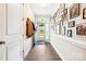 Bright entryway features wood-look flooring, a gallery wall and a blue front door at 620 River Birch Dr, Salisbury, NC 28146