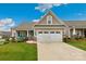 Charming home with a two-car garage, well-manicured lawn, and inviting front porch at 620 River Birch Dr, Salisbury, NC 28146