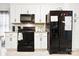 Well-equipped kitchen with black appliances and ample cabinet space at 620 River Birch Dr, Salisbury, NC 28146