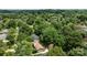 An aerial view captures the neighborhood's lush greenery and the home's peaceful setting at 6231 Coach Hill Ln, Charlotte, NC 28212