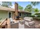 Spacious back deck with an outdoor seating area and grill at 6231 Coach Hill Ln, Charlotte, NC 28212