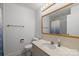 Classic bathroom design includes a vanity sink and a shower with a curtain, ideal for essential needs at 6231 Coach Hill Ln, Charlotte, NC 28212