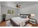 A staged bedroom features a comfortable bed, stylish decor, and a view to the outdoors at 6231 Coach Hill Ln, Charlotte, NC 28212