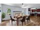 Dining room with modern table, chairs, and natural light at 6231 Coach Hill Ln, Charlotte, NC 28212
