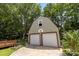 A detached two-car garage with a basketball hoop has additional storage space above at 6231 Coach Hill Ln, Charlotte, NC 28212