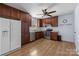 Kitchen with dark cabinets and stainless steel appliances at 6231 Coach Hill Ln, Charlotte, NC 28212