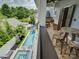 A nice backyard with a refreshing pool with inflatable pink rings, comfortable seating, and a lush green lawn at 628 Bracket St, Fort Mill, SC 29708