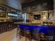 Finished basement bar featuring an extensive liquor selection and seating for entertaining at 628 Bracket St, Fort Mill, SC 29708