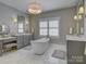 Luxurious bathroom with marble floors, a soaking tub, and double vanities at 628 Bracket St, Fort Mill, SC 29708