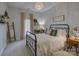 Comfortable bedroom with iron bed frame, bedside table and lamp, and quaint decor at 628 Bracket St, Fort Mill, SC 29708