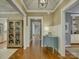 Elegant hallway featuring beautiful hardwood floors, detailed trim, and stylish decor at 628 Bracket St, Fort Mill, SC 29708