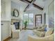 Living room boasts a fireplace, exposed beams, and an abundance of natural light at 628 Bracket St, Fort Mill, SC 29708
