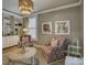 Cozy living room with built-in bookshelves, stylish seating, and attractive decor at 628 Bracket St, Fort Mill, SC 29708