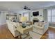 Bright living room features hardwood floors, fireplace, built-in shelving, and an open floor plan at 628 Bracket St, Fort Mill, SC 29708