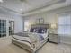 Main bedroom with tray ceiling, carpet, and French doors to an outdoor space at 628 Bracket St, Fort Mill, SC 29708