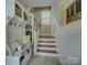 Mudroom with coat hooks, a bench, storage and access to stairs at 628 Bracket St, Fort Mill, SC 29708