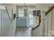 View of mudroom with custom cabinets, utility sink, stairs and coat hooks at 628 Bracket St, Fort Mill, SC 29708