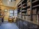 Inviting home office with custom built-in bookshelves and cabinets for storage at 628 Bracket St, Fort Mill, SC 29708