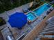 Aerial view of the backyard with a pool, spa, firepit, and outdoor seating at 628 Bracket St, Fort Mill, SC 29708