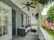 Relaxing covered porch featuring comfortable seating, ceiling fans, and an American flag at 628 Bracket St, Fort Mill, SC 29708