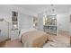 Comfortable bedroom features a murphy bed and an efficiently-designed kitchen, offering a versatile and functional living space at 630 Calvert St # 111, Charlotte, NC 28208