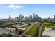 Skyline view of city buildings, office spaces, green tree tops, roads, and parking lots at 630 Calvert St # 111, Charlotte, NC 28208