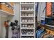 Well-organized closet with shelves for shoes, baskets, and clothing racks for hanging items at 630 Calvert St # 111, Charlotte, NC 28208