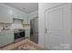 Well-equipped kitchen features stainless steel appliances, sleek cabinetry, and a clean design, creating an efficient cooking space at 630 Calvert St # 111, Charlotte, NC 28208