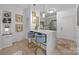 Well-designed kitchen with marble countertops, bar seating, and pendant lighting offers a seamless blend of style and functionality at 630 Calvert St # 111, Charlotte, NC 28208