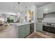 Modern kitchen features marble countertops, a kitchen island, and stainless steel appliances, perfect for cooking and entertaining at 630 Calvert St # 111, Charlotte, NC 28208