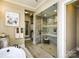 Modern bathroom featuring a glass shower with gray tile and wood look floors at 6510 Honeymeade Cir, Charlotte, NC 28277