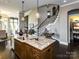 Open kitchen featuring granite countertops, dark wood cabinetry and hardwood floors at 6510 Honeymeade Cir, Charlotte, NC 28277