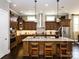 An open kitchen is brightened by pendant lighting and features a large island at 6510 Honeymeade Cir, Charlotte, NC 28277