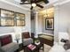 Cozy living room featuring hardwood floors, modern furniture, decorative pillars and elegant lighting at 6510 Honeymeade Cir, Charlotte, NC 28277