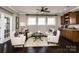 Bright living room features hardwood floors, elegant furniture, and a ceiling fan at 6510 Honeymeade Cir, Charlotte, NC 28277