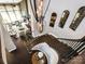 Spiral staircase featuring dark wood floors and an open view of the living area at 6510 Honeymeade Cir, Charlotte, NC 28277